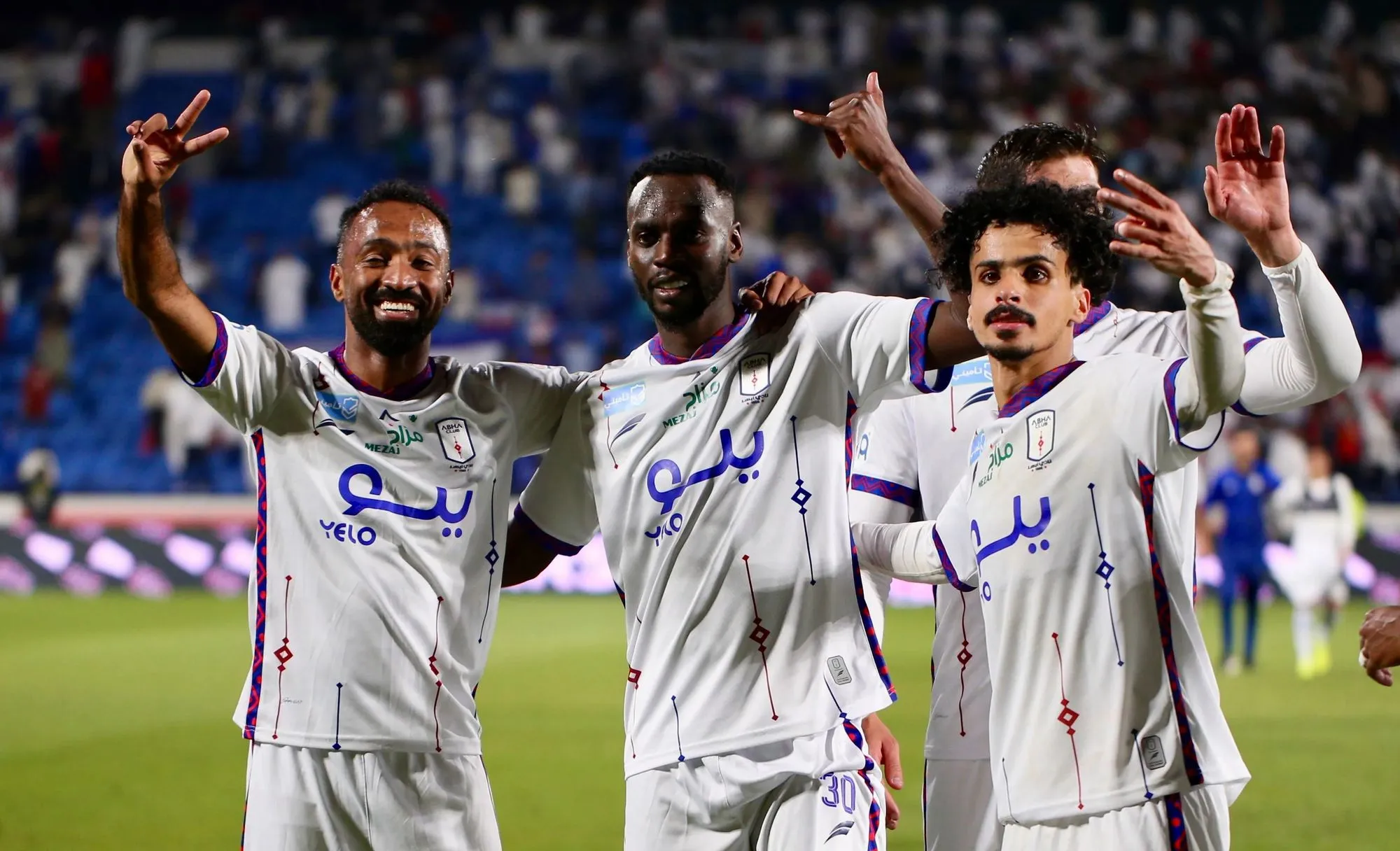 Abha players celebrate their victory over Al Khaleej with smiles and hand gestures