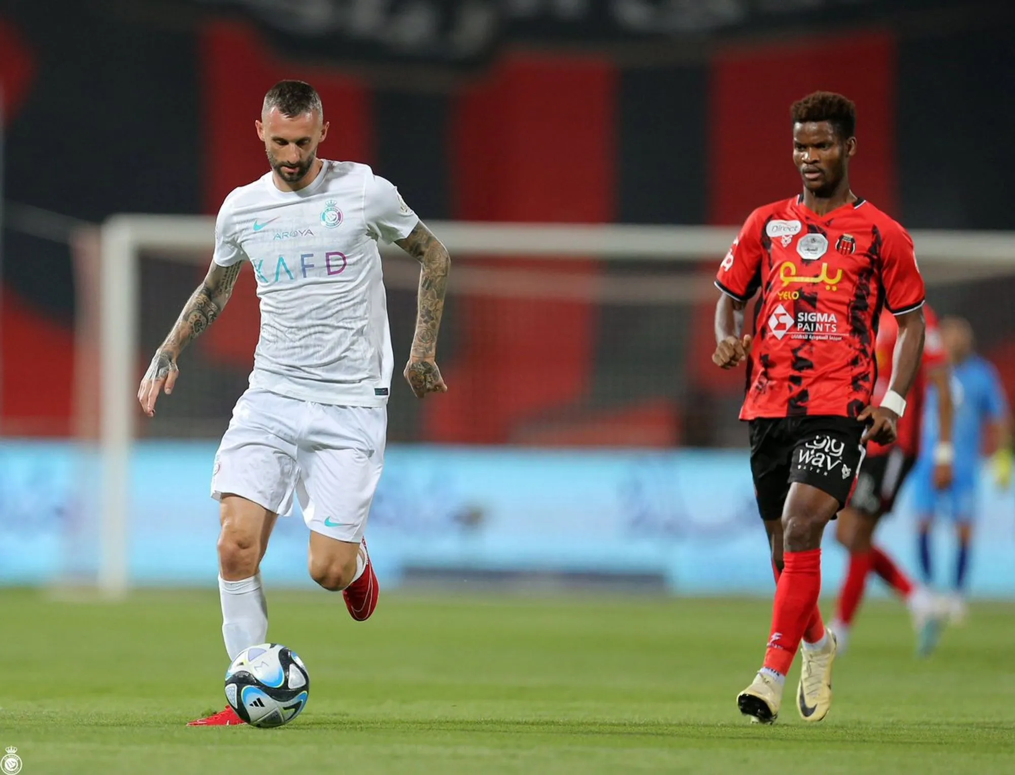 Marcelo Brozovic with the ball at his feet as an Al Riyadh player gives chase.