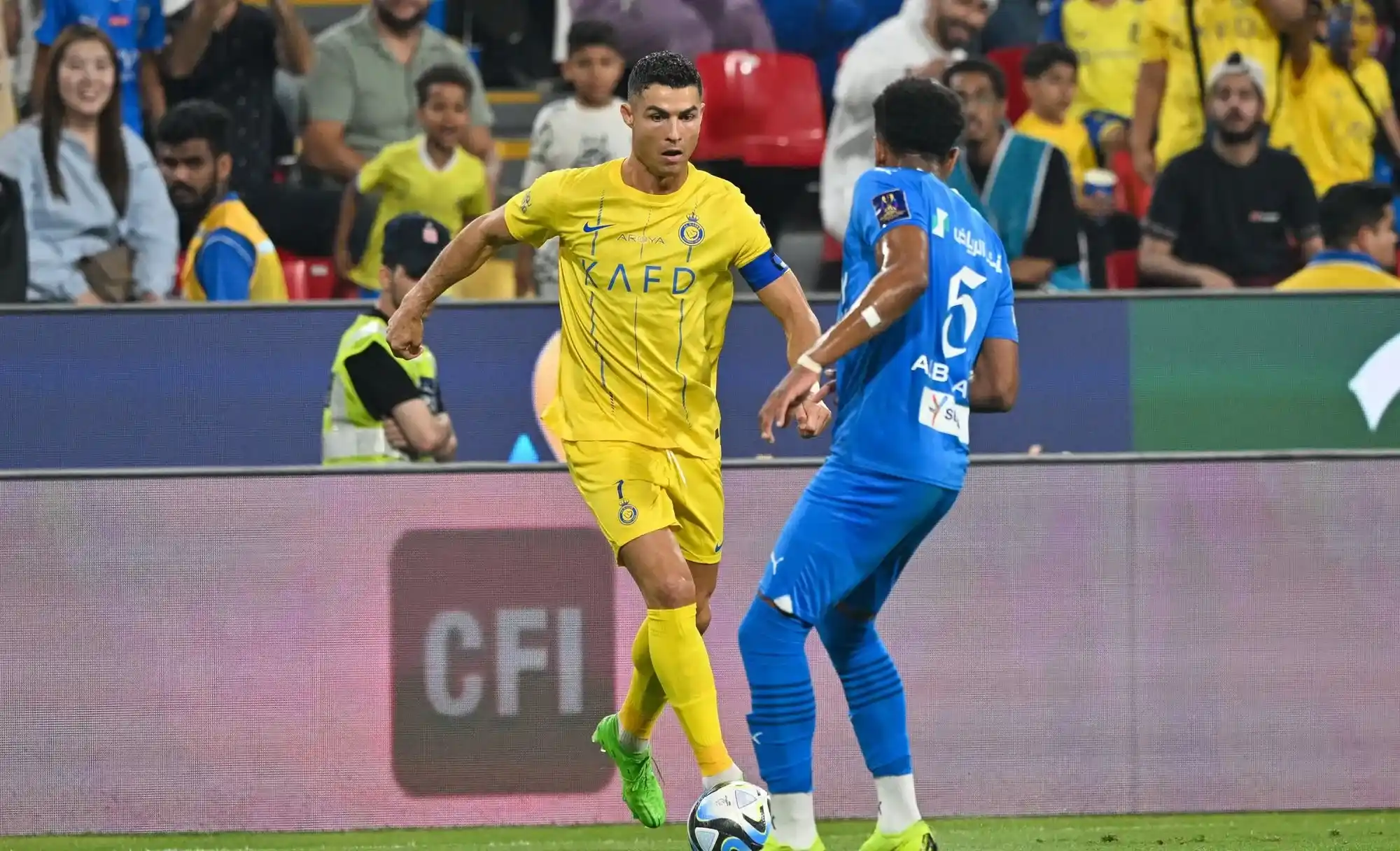 Cristiano Ronaldo controls the ball against an Al Hilal player in a past match.