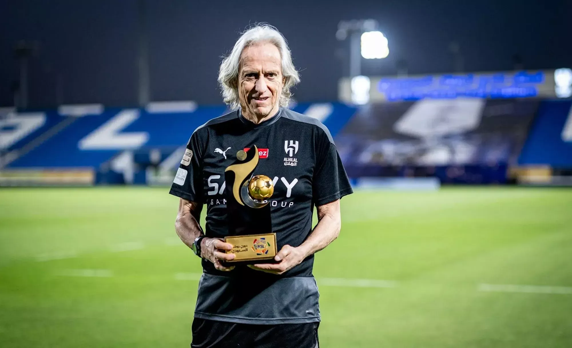 Jorge Jesus displays his Manager of the Year award trophy.