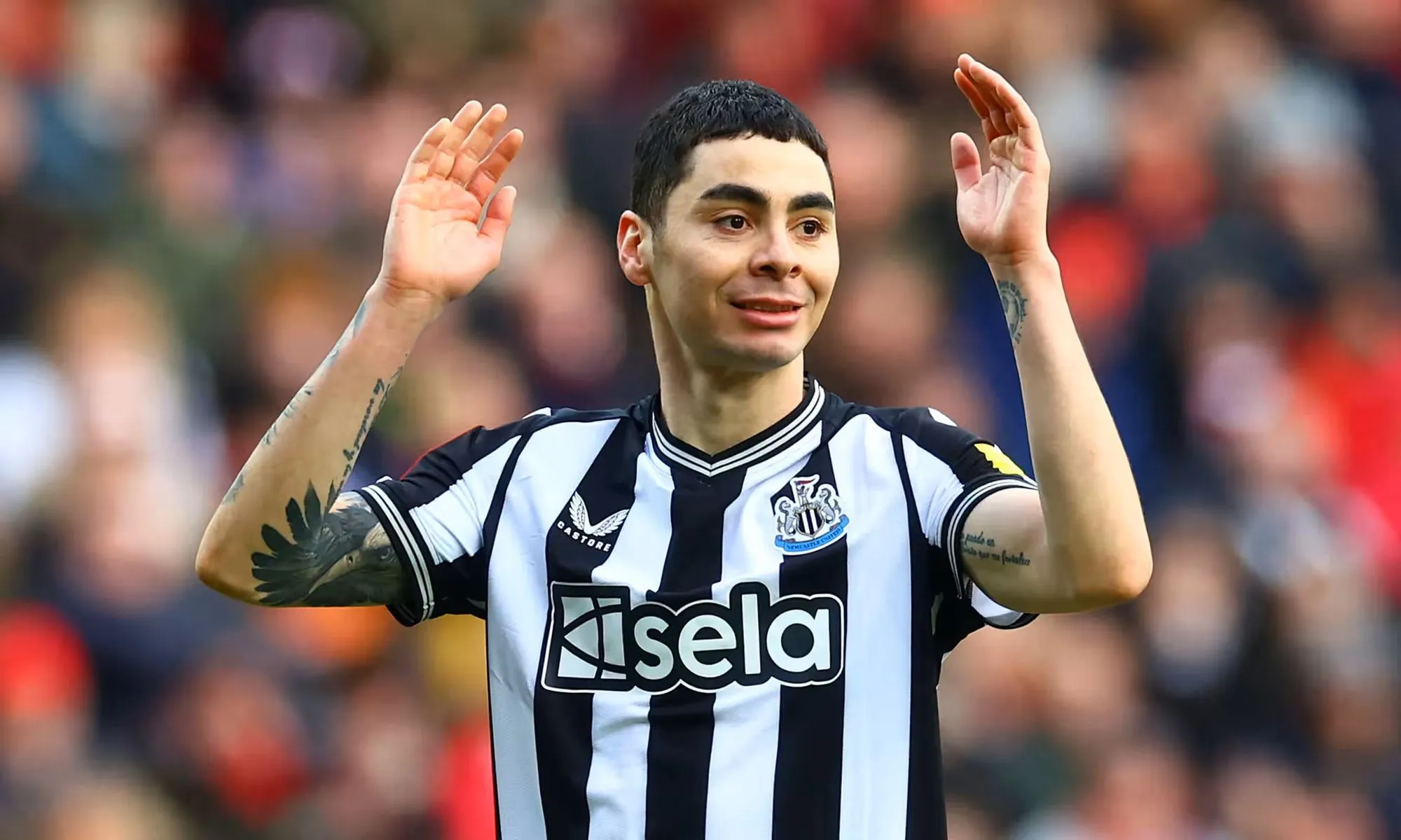 Miguel Almirón Raises His Hands During A Newcastle Home Match.