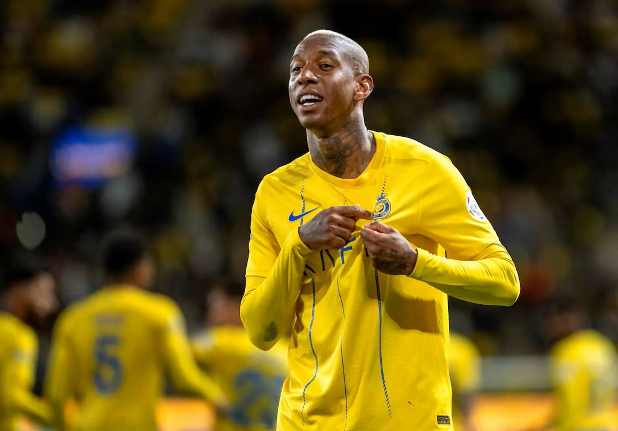 Anderson Talisca Points To the Al Nassr Badge After Scoring a Goal in A Past Match