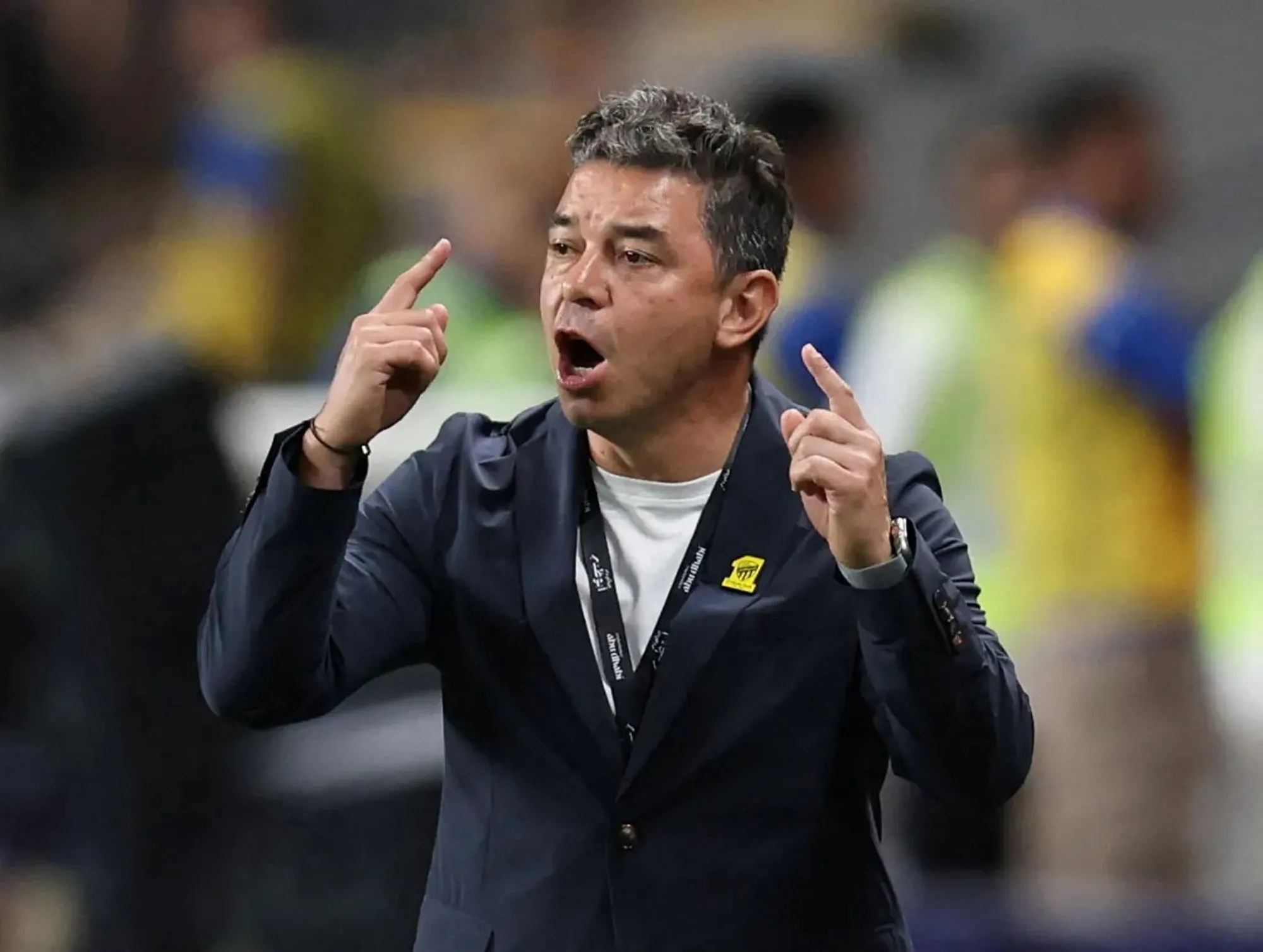 Former Al Ittihad manager Marcelo Gallardo gestures while giving instructions during a match.