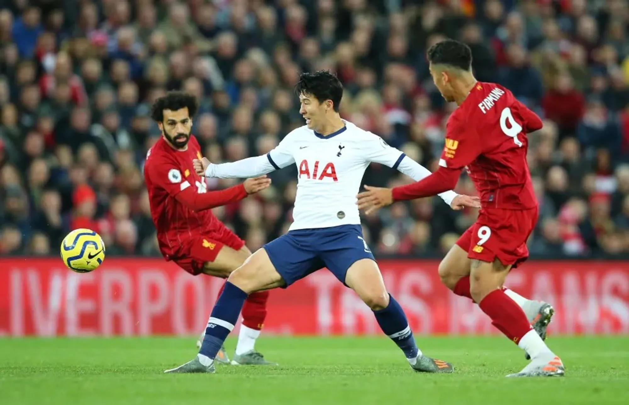 Heung Min Son Shields the Ball From Mohamed Salah and Roberto Firminho in a Past Match.