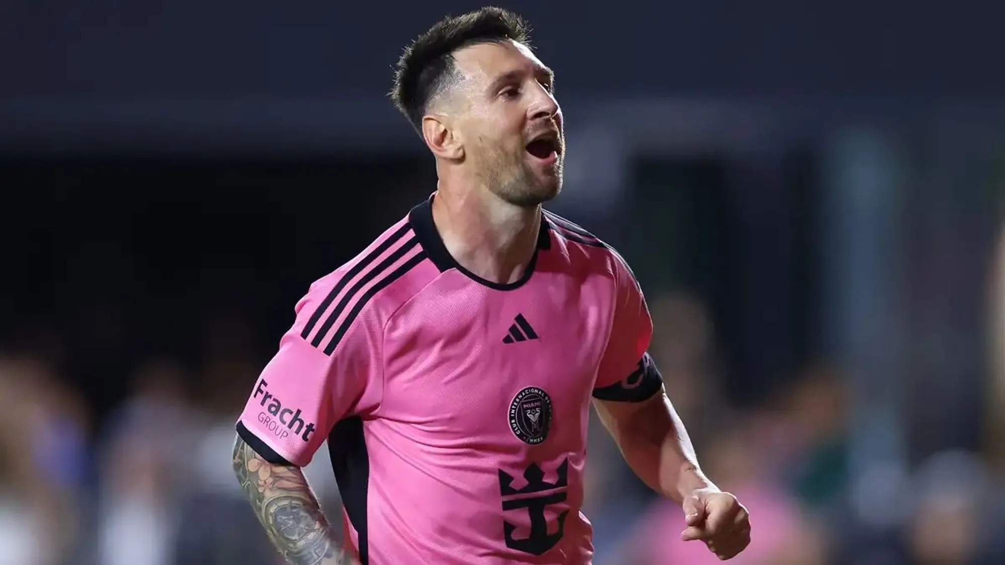 Lionel Messi, in an Inter Miami Kit, Celebrates A Goal in a Past Match.