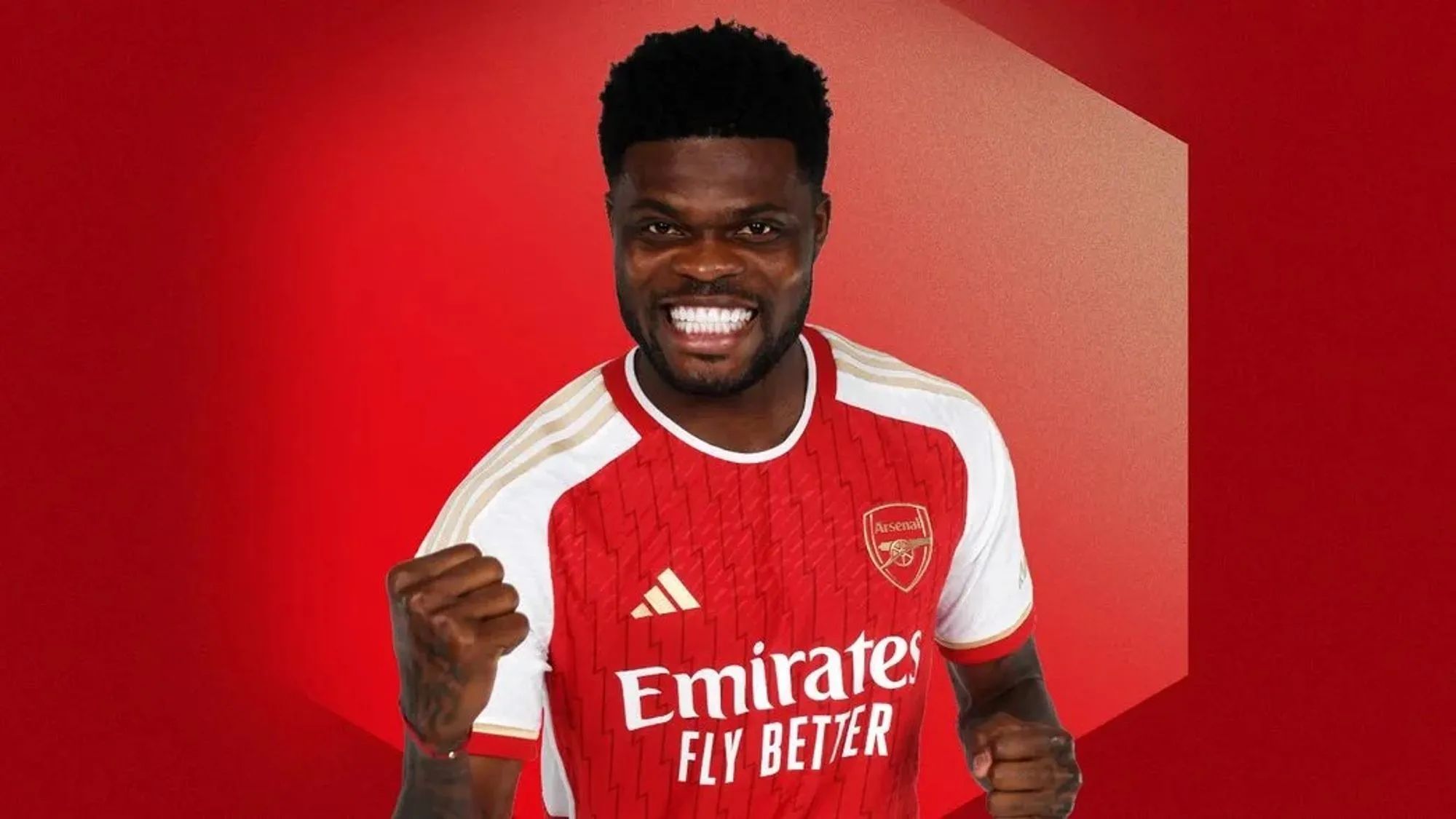 Thomas Partey Pumps His Fist in An Official Club Portrait.