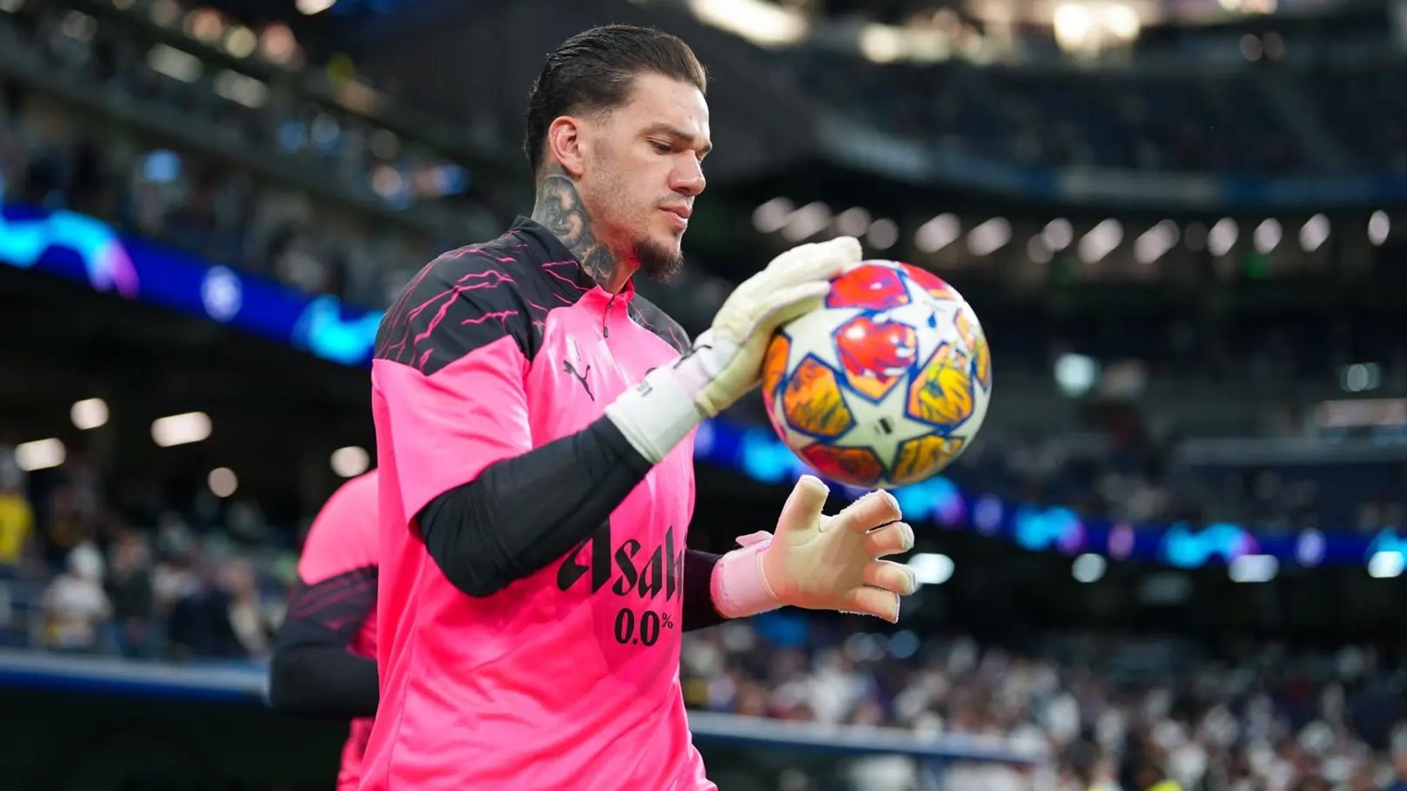 Ederson, Wearing Manchester City’s Training Kit, Palms A Football in His Hands.