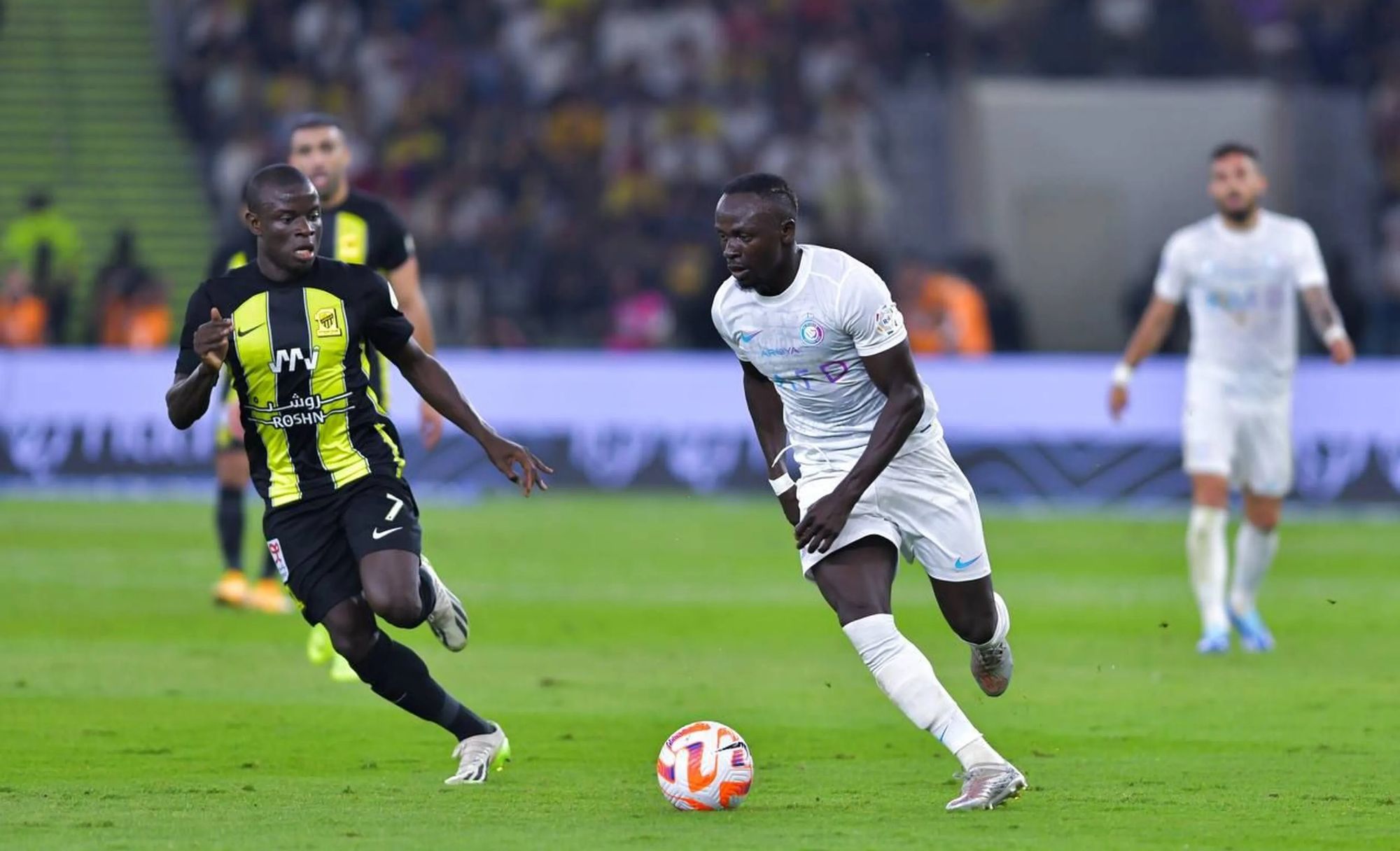 N'Golo Kante, Al Ittihad's Shining Star In Midfield, Tussles for the Ball With Al Nassr's Sadio Mane in a Past Match.