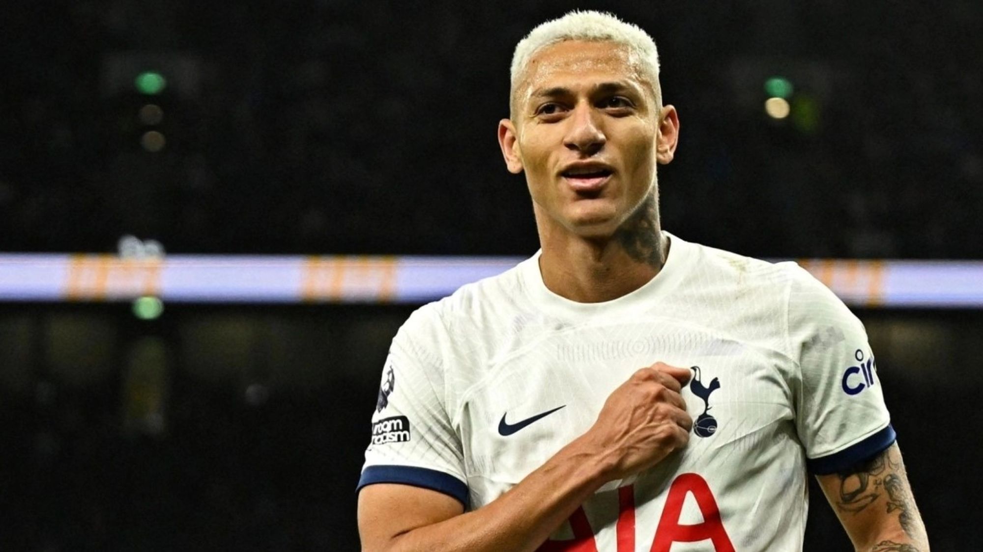 Richarlison Places His Fist on His Chest During A Past Match For Tottenham Hotspur.