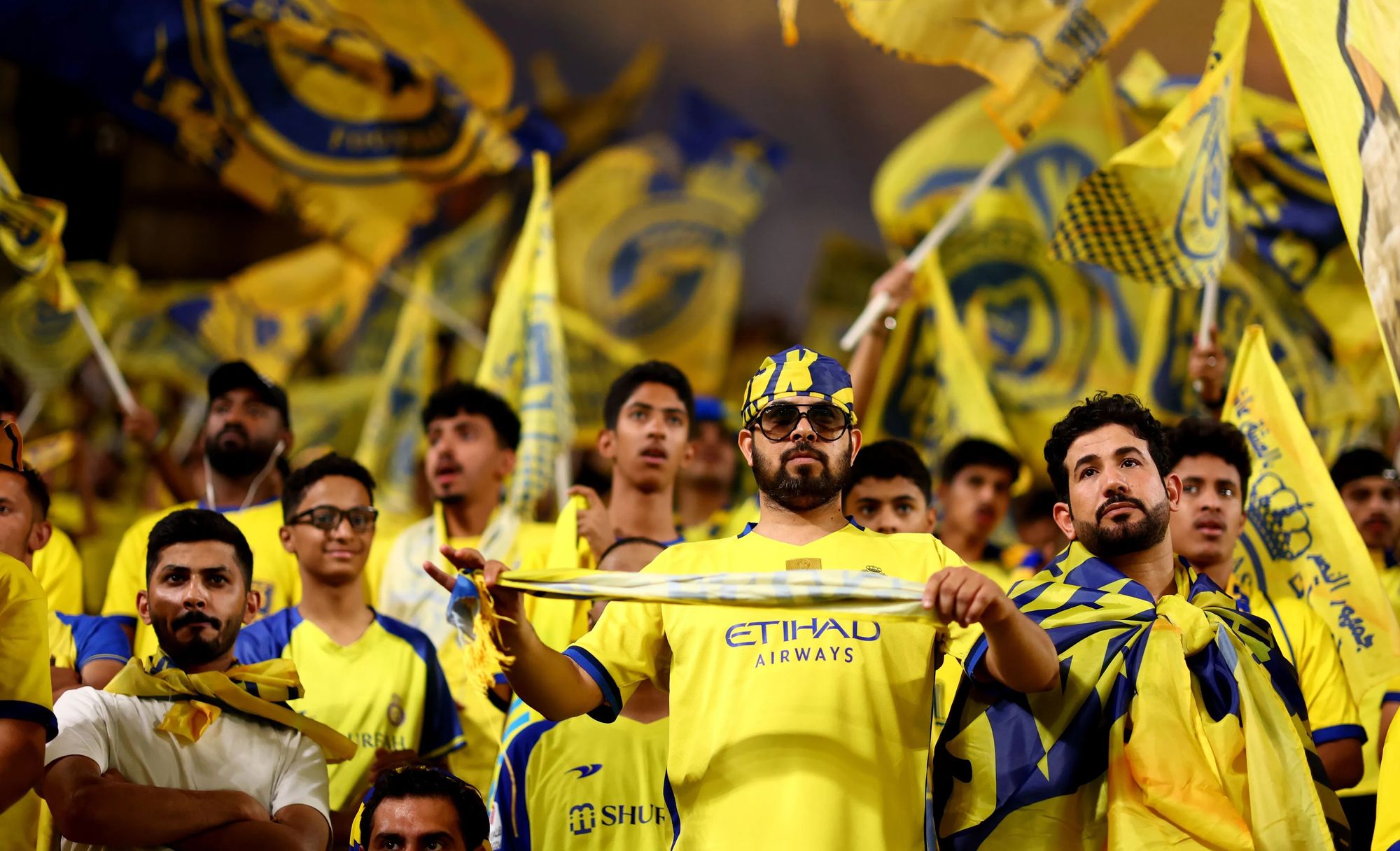 Al Nassr Fans Draped In the Club's Jerseys During a Past Match.