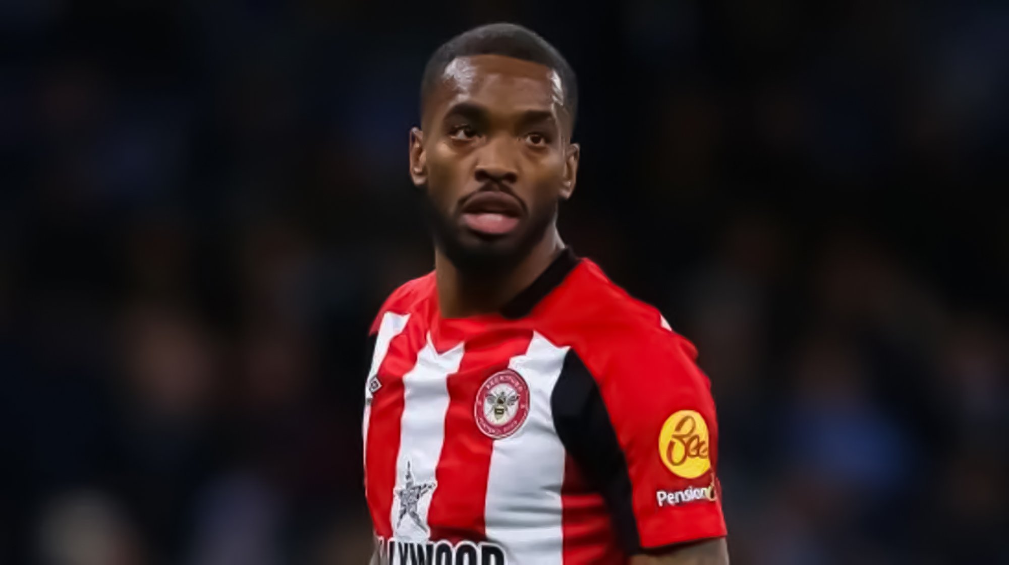 Ivan Toney Dressed in Brentford's Home Red and White Kit During a Past Match.